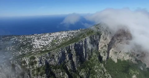 CINEMATIC FLY THROUGH EPIC CLOUDS AT TOP OF TOURIST MOUNTAIN Stock Footage 63313891