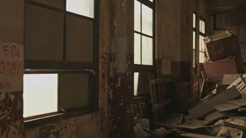 Cinematic fly-through of a messy abandoned storage room filled with debris. Stock Footage 327688324