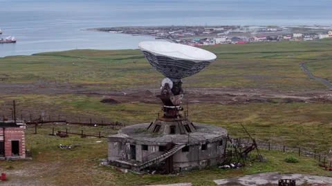 Cinematic flyover of decaying Orbita space communications base on remote tundra Stock Footage 327125656