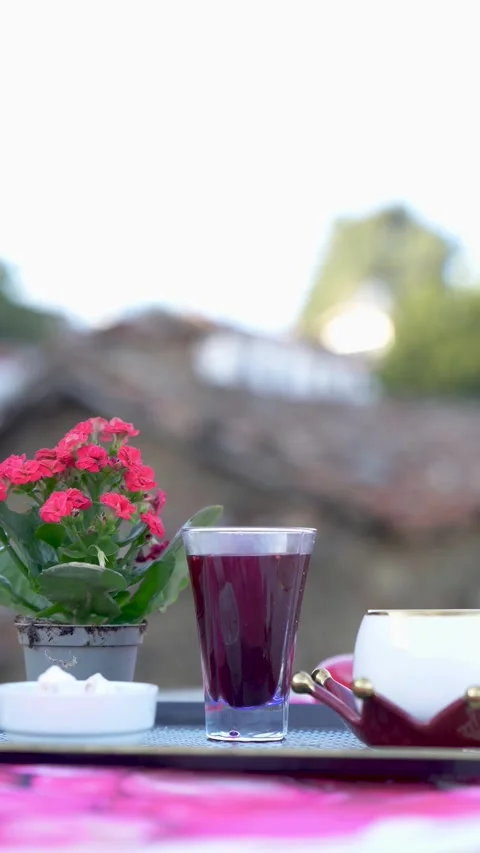 Cinematic Focus Pull Stone Village Exterior to Traditional Coffee Service Stock Footage 323403458