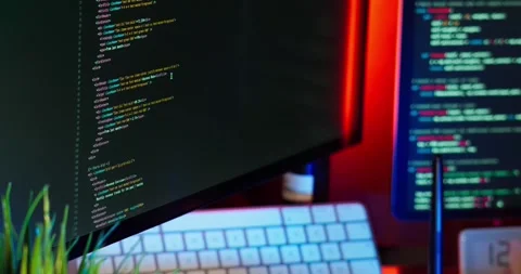 Cinematic footage of a dynamic coding workspace illuminated with RGB lighting Stock-Footage 318597276