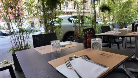 Cinematic footage of an empty outdoor table at a rustic Italian cafe Stock Footage 341252901