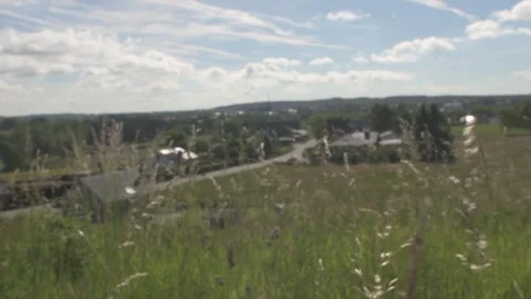 Cinematic Foreground Grass In Front of Belgium or European Town Stock Footage 325263139