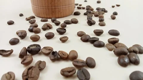Cinematic forward camera movement over roasted coffee beans and wooden bowl Stock Footage 335143941