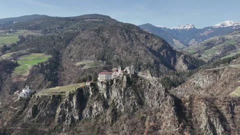 Cinematic Forward Drone Flyover of Klausen Abbey with Dolomites View Vídeo Stock 335445761