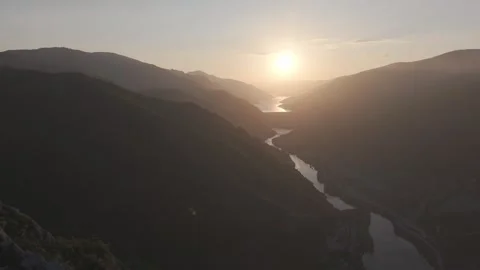 Cinematic Forward Flight Over Ancient River Valley at Sunset Stock Footage 337465691