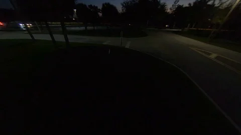 A cinematic FPV cinewhoop drone buzzes over the local police at the FIU Stock Footage 129045346