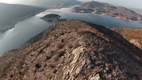 Cinematic FPV Drone Dive Over Tikvesh Lake and Snake Bay, Macedonia Video stock 327931448