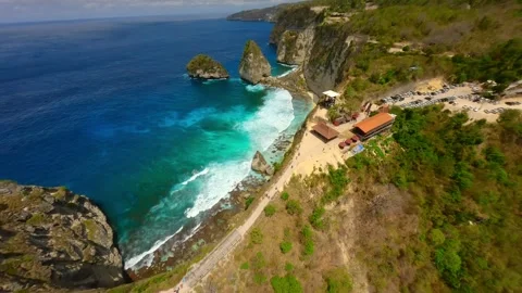 Cinematic FPV drone flight above Diamond Beach cliffs and turquoise sea, Bali Video stock 309982441