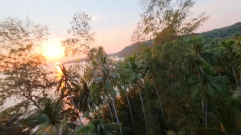 Cinematic FPV drone flight above tropical coastline at sunset in Thailand. Stockbeeldmateriaal 336683893