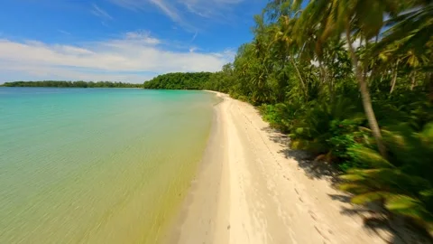 Cinematic FPV drone flight over white sandy tropical beach in Thailand. Stock Footage 257732964
