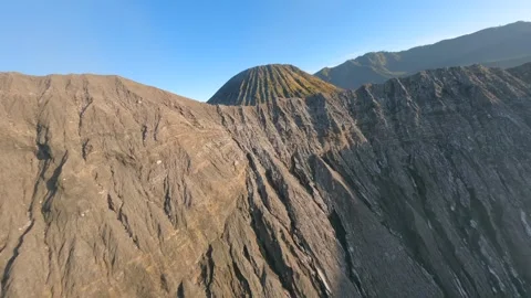 Cinematic FPV drone flight over Mount Bromo crater toward Mount Batok, Indonesia Видео 336682229