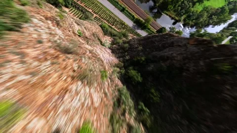 Cinematic FPV Drone Flight – Smooth Split-S Dive Along Mountain Cliffs Vídeos de archivo 317581377