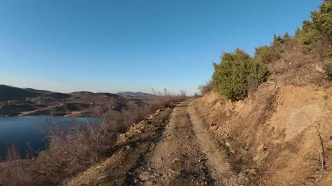 Cinematic FPV Drone Low Flight Along Goat Path by Tikvesh Lake, Macedonia Stock Footage 330610801