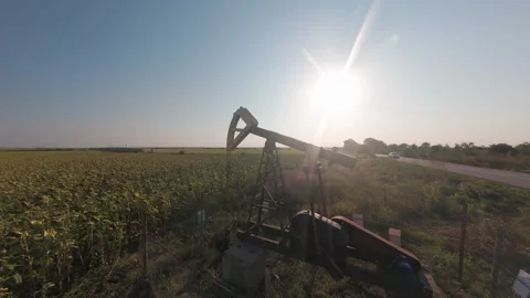 Cinematic FPV drone orbit around oil pumpjack near Shabla, Bulgaria. Stock Footage 342137176