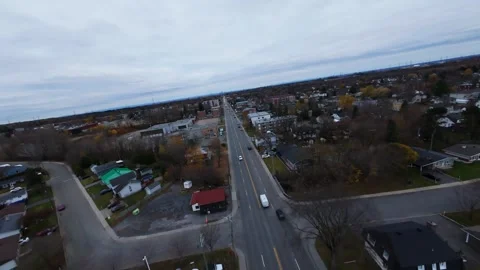 Cinematic fpv drone shot over quiet wet city road original file edition Stock Footage 320375681