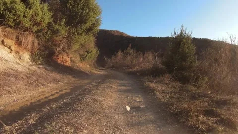 Cinematic FPV Drone Slow Low Flight Along Goat Path with Dust, Macedonia Video stock 330610854