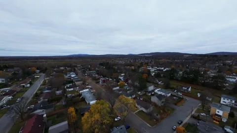 Cinematic fpv flight above quiet city road in cloudy dusk original file edition Stock Footage 320376146