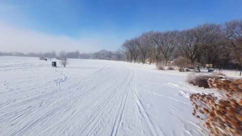 Cinematic FPV Flight Over Snowy Park Path — Winter Landscape Stock Footage 323247907