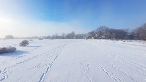 Cinematic FPV Flight Over Snowy Park Path — Winter Landscape Stock Footage 323247951