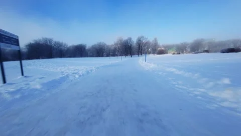 Cinematic FPV Flight Over Snowy Park Path — Winter Landscape Stock Footage 323248324