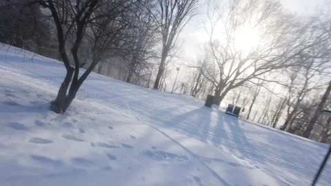 Cinematic FPV Flight Over Snowy Park Path — Winter Landscape Stock Footage 323249342