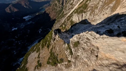 Cinematic FPV Flight Over Withered Mountain Slope Winter, 4K Stock Footage 323462605