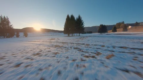Cinematic FPV over a Cold Golf Club Grass in a Winter Sunset Stock Footage 123463418