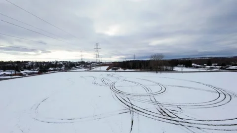 Cinematic fpv winter field flyover with lone tree and power lines Stock Footage 321380808