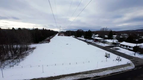 Cinematic fpv winter field flyover with lone tree and power lines Stock Footage 321380976