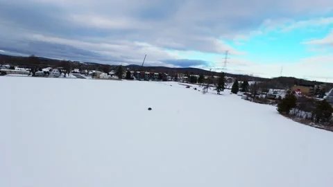Cinematic fpv winter field flyover with lone tree and power lines Stock Footage 321381038