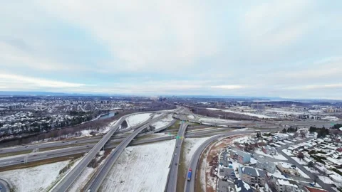 Cinematic fpv winter highway interchange — aerial city traffic view Stock Footage 321433719