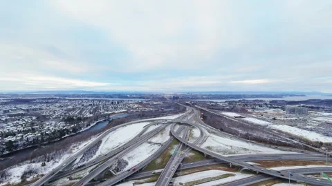 Cinematic fpv winter highway interchange — aerial city traffic view Stock Footage 321433730