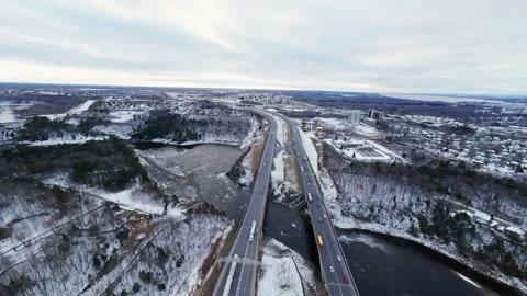 Cinematic fpv winter highway interchange — aerial city traffic view Stock Footage 321433795