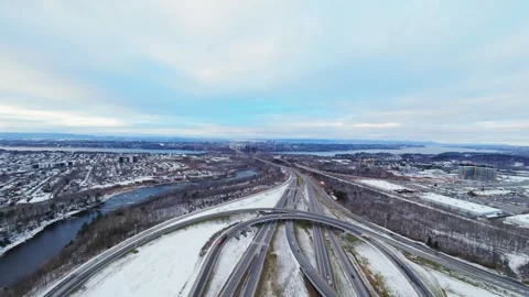 Cinematic fpv winter highway interchange — aerial city traffic view Stock Footage 321433892