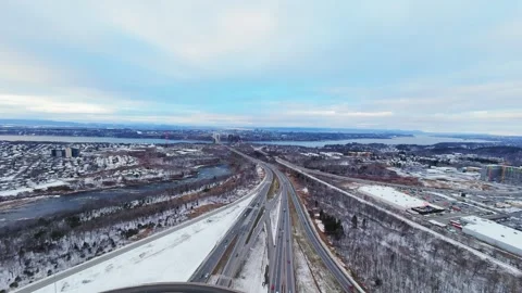 Cinematic fpv winter highway interchange — aerial city traffic view Stock Footage 321433906