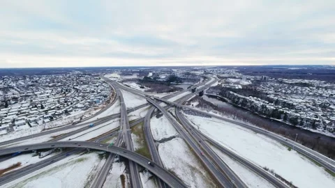 Cinematic fpv winter highway interchange — aerial city traffic view Stock Footage 321433936