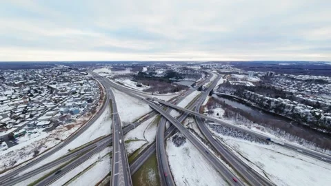 Cinematic fpv winter highway interchange — aerial city traffic view Stock Footage 321433975