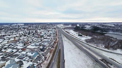 Cinematic fpv winter highway interchange — aerial city traffic view Stock Footage 321434014