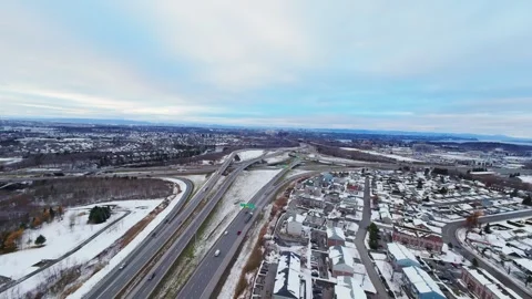 Cinematic fpv winter highway interchange — aerial city traffic view Stock Footage 321434073