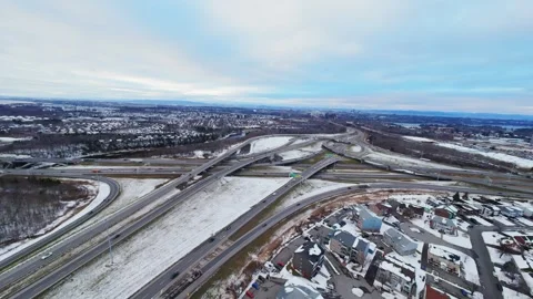 Cinematic fpv winter highway interchange — aerial city traffic view Stock Footage 321434083