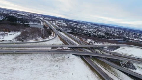 Cinematic fpv winter highway interchange — aerial city traffic view Stock Footage 321434095