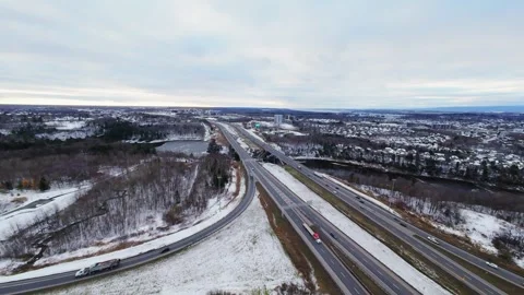 Cinematic fpv winter highway interchange — aerial city traffic view Stock Footage 321434104