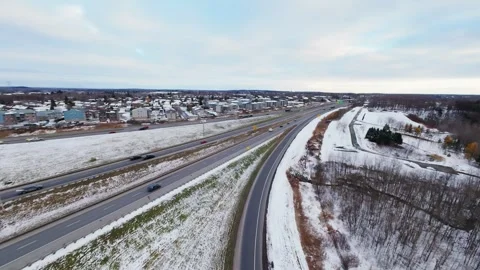 Cinematic fpv winter highway interchange — aerial city traffic view Stock Footage 321434122