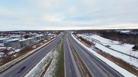 Cinematic fpv winter highway interchange — aerial city traffic view Stock Footage 321434135