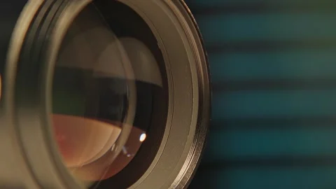 Cinematic glass and mechanical camera lens in slo motion lenses flare Stock Footage 340428692