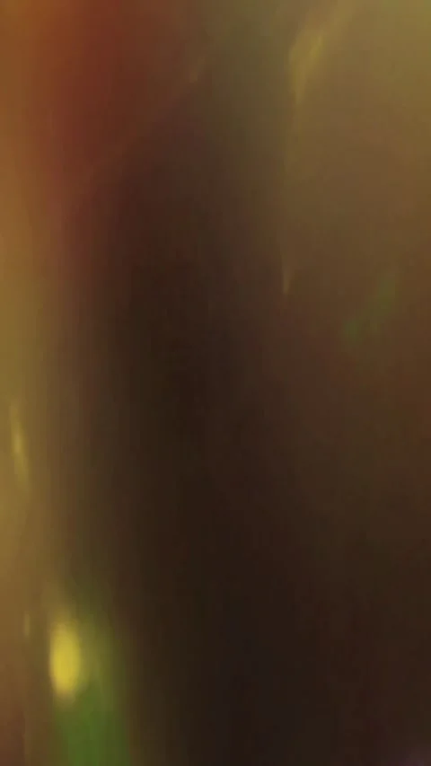Cinematic golden light rays shining through dark atmosphere Stock Footage 339778737