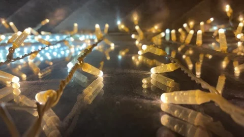 Cinematic Golden String Lights with Flashing Cool White Fairy Lights in Bokeh Stock Footage 331493190