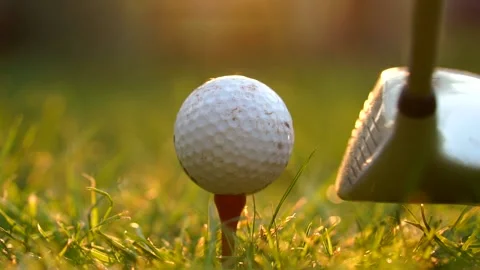 Cinematic Golfer At Sunset, Close Up Of Ball Hit Off Tee In Golf Drive Shot Stock Footage
