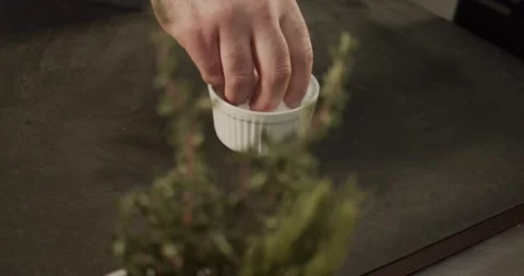 Cinematic Grabbing Salt On Cutting Board 4K Stock Footage